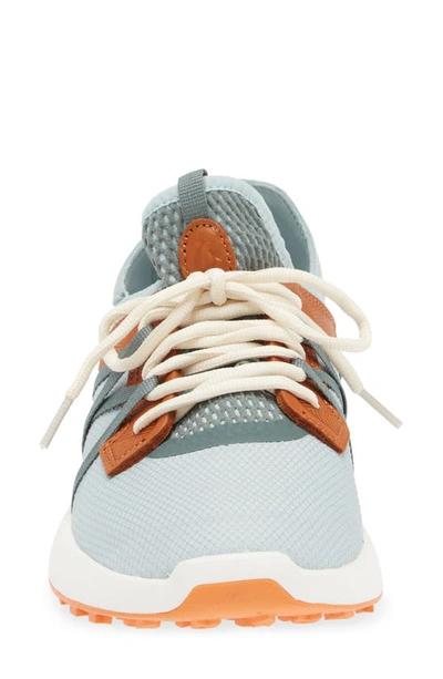 Shop Olukai Manele Golf Shoe In Pale Moss/ Molten Orange