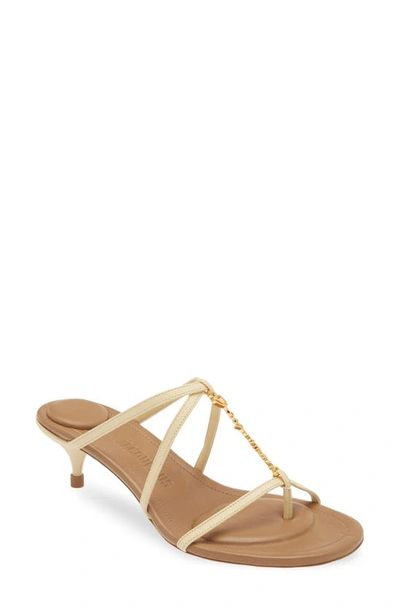 Shop Jacquemus Strappy Logo Charm Sandal In Ivory