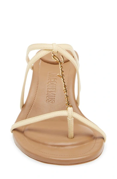 Shop Jacquemus Strappy Logo Charm Sandal In Ivory