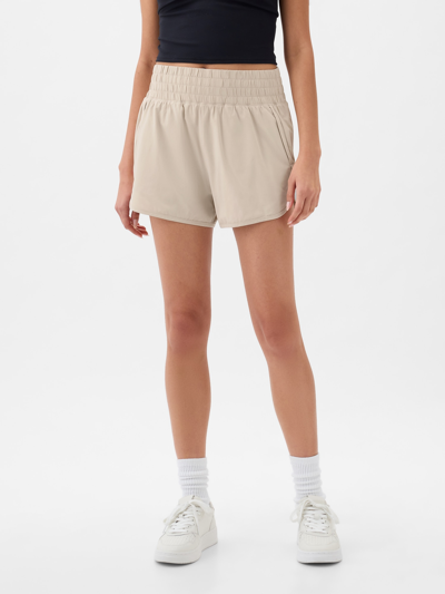 Shop Gap Fit High Rise Running Shorts In Moonstone Beige