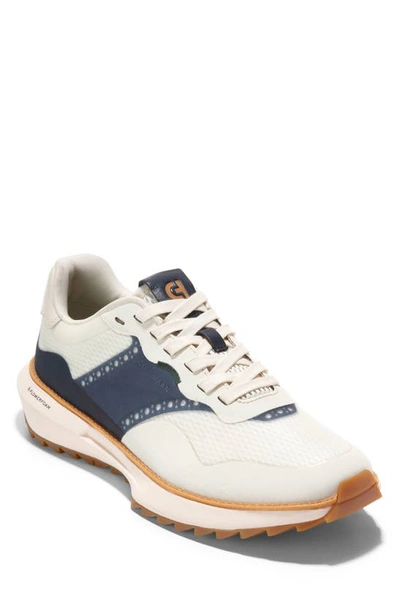Shop Cole Haan Grandpro Ashland Golf Sneaker In Ivory/ Navy Blazer/ Ivory