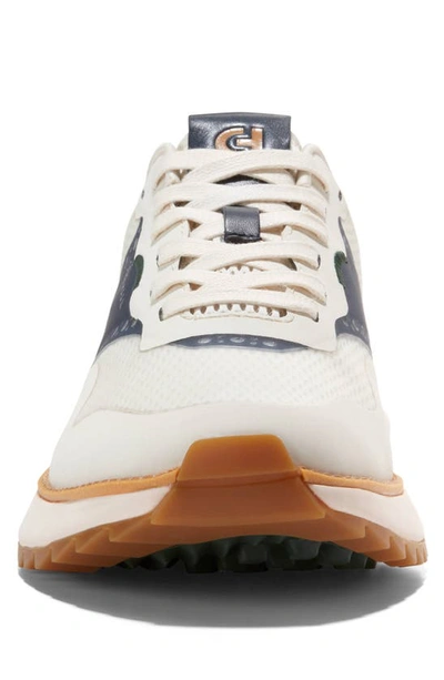 Shop Cole Haan Grandpro Ashland Golf Sneaker In Ivory/ Navy Blazer/ Ivory
