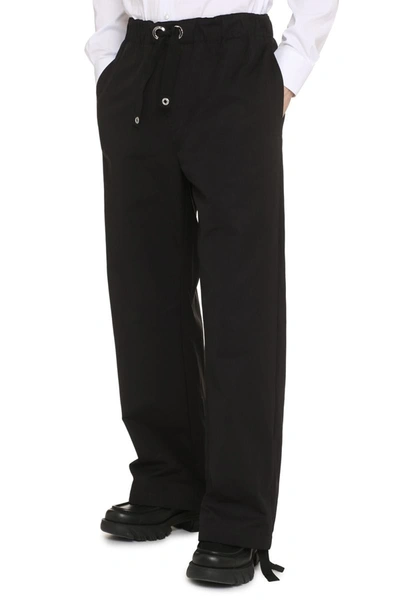 Shop Versace Cotton Trousers In Black