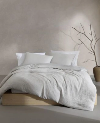 Shop Calvin Klein Washed Texture Solid Cotton Jacquard Duvet Cover Sets In White