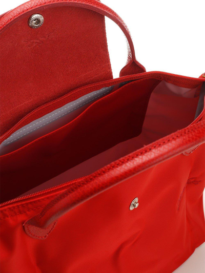 Shop Longchamp Le Pliage Small Top Handle Bag In Red