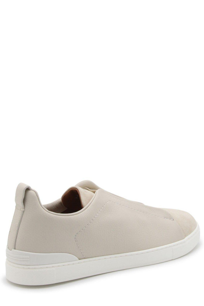 Shop Zegna Round-toe Logo-engraved Sneakers In Pan