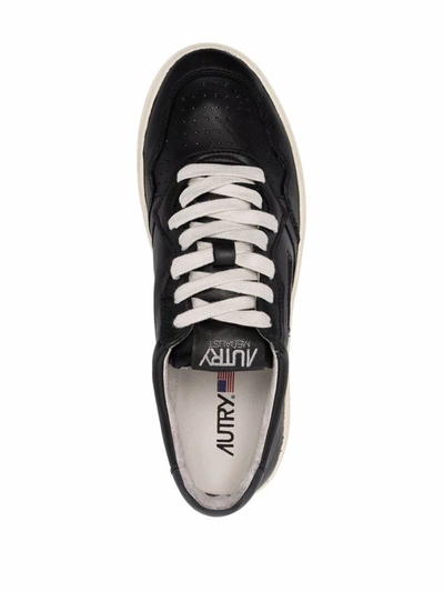 Shop Autry Sneakers In Black