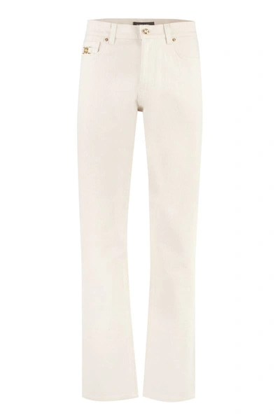 Shop Versace Straight Leg Jeans In Ecru