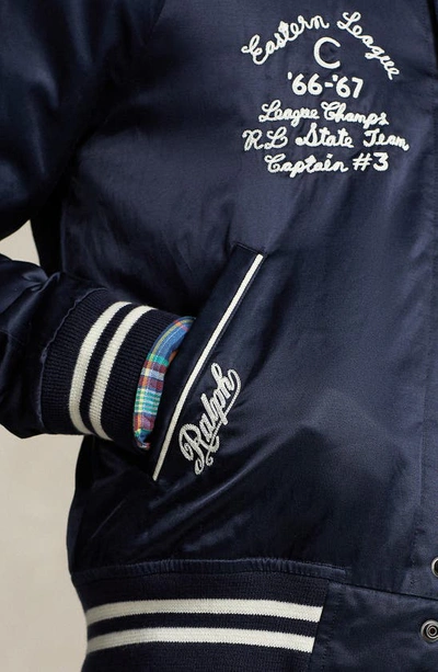 Shop Polo Ralph Lauren Satin Varsity Bomber Jacket In Aviator Navy