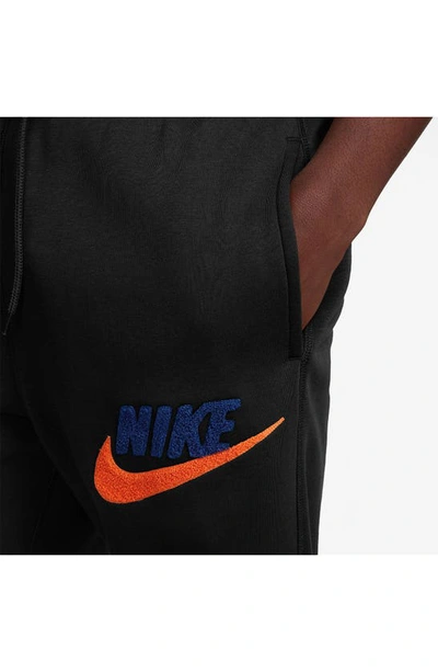 Shop Nike Cotton Blend Fleece Joggers In Black/ Royal Blue/ Orange