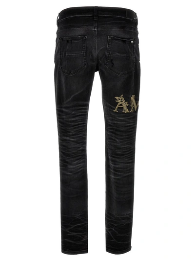 Shop Amiri 'baroque Logo' Jeans In Black