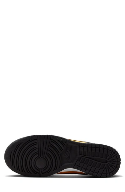 Shop Nike Dunk Low Sneaker In Black/ University Gold/ White