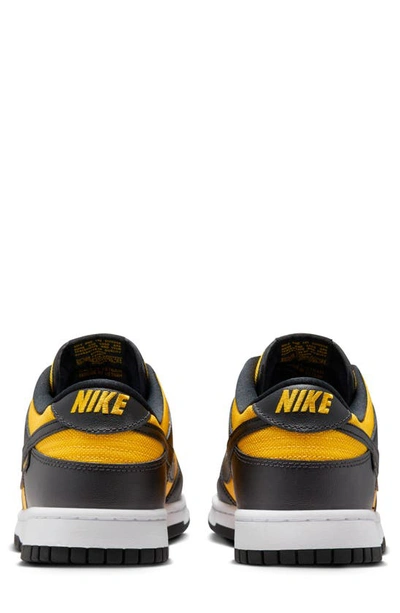 Shop Nike Dunk Low Sneaker In Black/ University Gold/ White