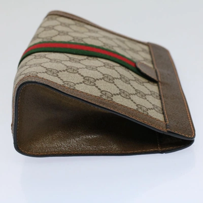 Shop Gucci Web Brown Canvas Clutch Bag ()