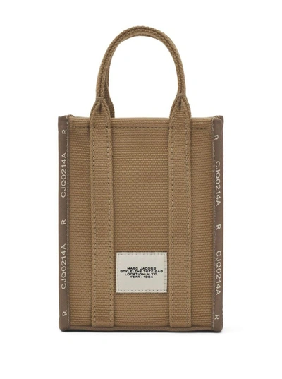 Shop Marc Jacobs Handbags. In Beige