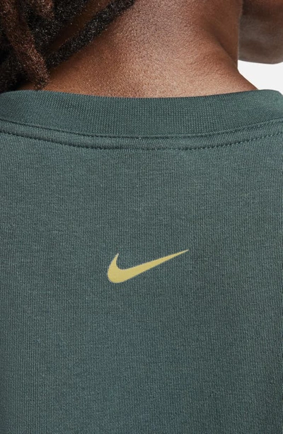 Shop Nike One Dri-fit Crewneck Graphic Sweatshirt In Deep Jungle/ Bronzine