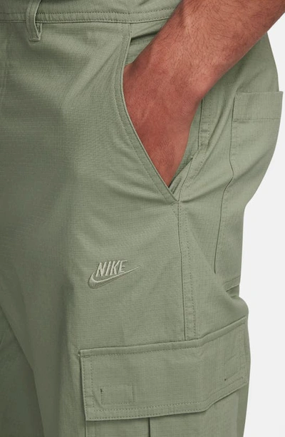 Shop Nike Club Stretch Cotton Cargo Pants In Oil Green/ Oil Green