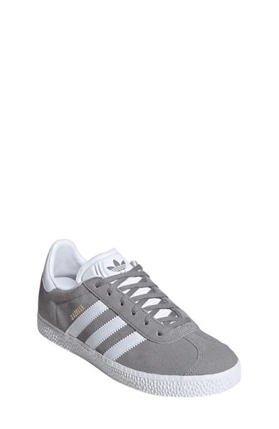 Shop Adidas Originals Kids' Gazelle Low Top Sneaker In Grey/ White/ Gold Metallic
