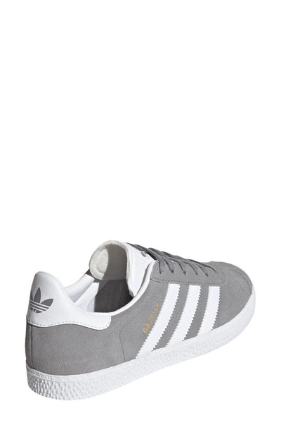 Shop Adidas Originals Kids' Gazelle Low Top Sneaker In Grey/ White/ Gold Metallic