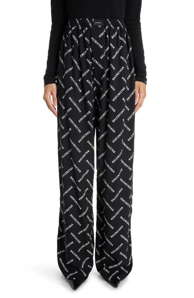 Shop Balenciaga Logo Print Wide Leg Pants In Black/ White