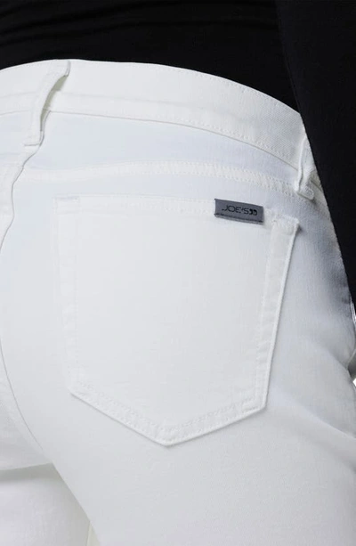 Shop Joe's Mid Rise Bootcut Jeans In White