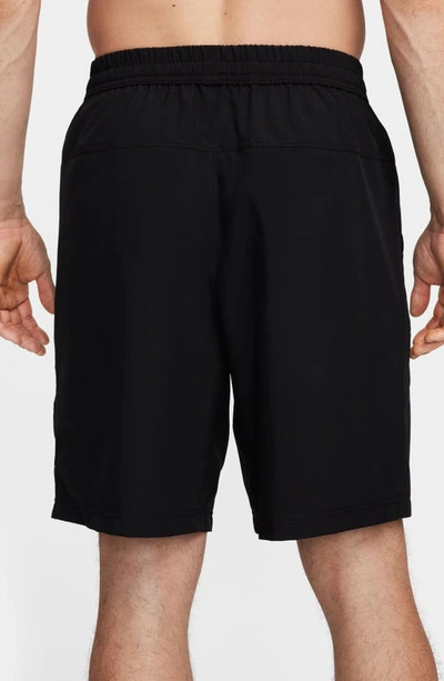 Shop Nike Form Dri-fit 9-inch Unlined Versatile Shorts In Black/ White