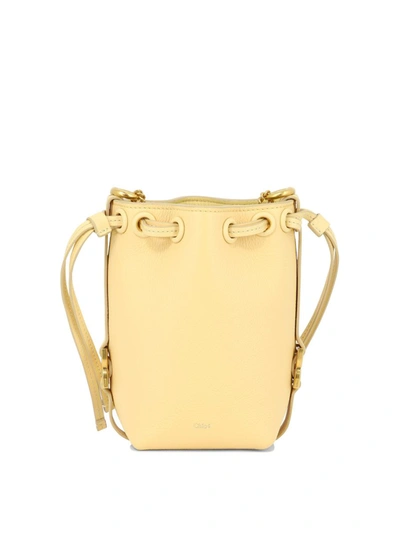 Shop Chloé "micro Marcie" Bucket Bag In Yellow