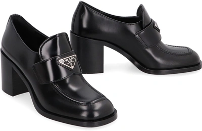 Shop Prada Heeled Loafers In Black