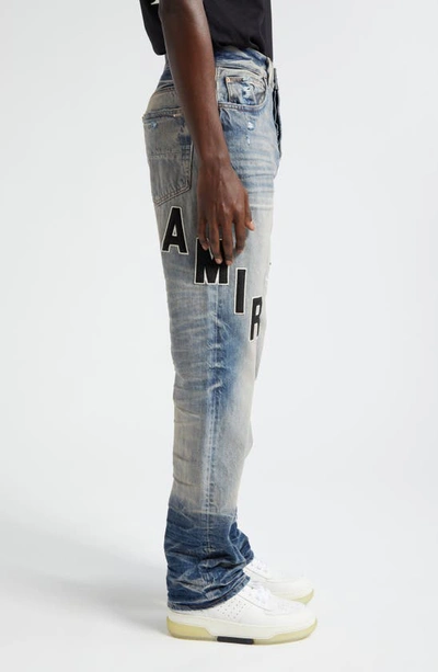Shop Amiri Hockey Logo Straight Leg Jeans In Vintage Indigo