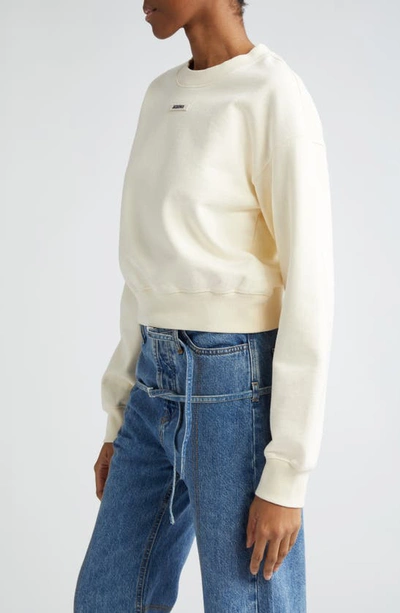 Shop Jacquemus Le Grosgrain Logo Cotton Fleece Crop Sweatshirt In Light Beige