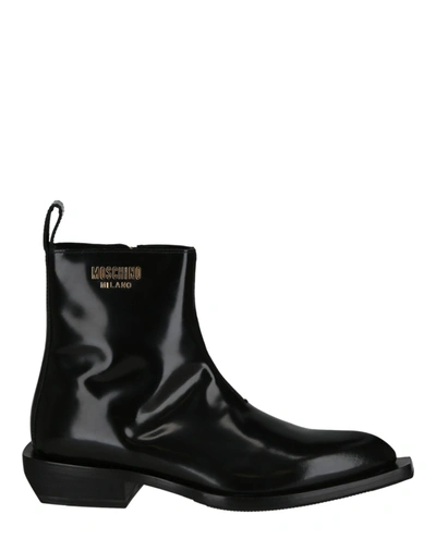 Shop Moschino Gold Lettering Logo Ankle Boots In Black