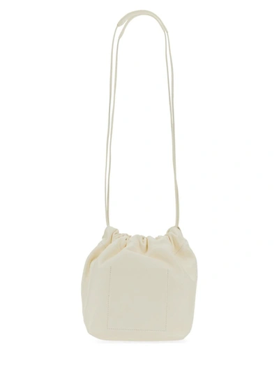 Shop Jil Sander Dumpling Bag. In Ivory