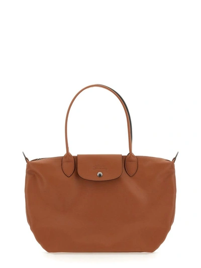 Shop Longchamp "le Pliage" Bag In Buff
