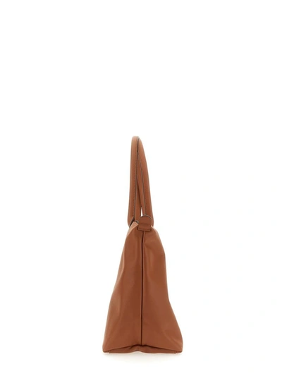 Shop Longchamp "le Pliage" Bag In Buff