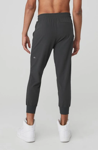 Shop Alo Yoga Co-op Water Repellent Pocket 7/8 Joggers In Anthracite