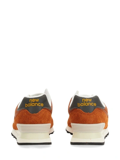 Shop New Balance Sneaker 574 In Orange