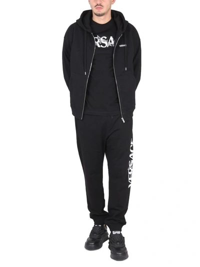 Shop Versace Jogging Pants With Logo In Black