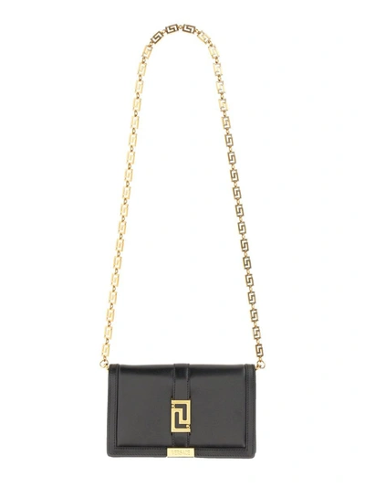 Shop Versace Mini "greca Goddess" Bag In Black