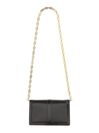Shop Versace Mini "greca Goddess" Bag In Black