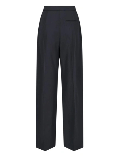 Shop Alexander Mcqueen Trousers In Black