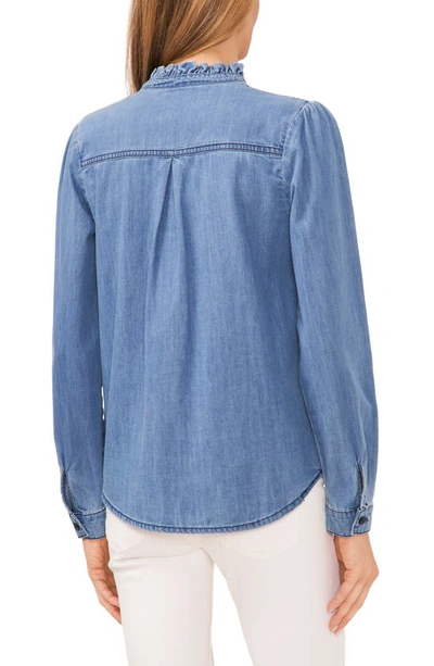 Shop Cece Ruffle Denim Button-up Top In Chambray Blue
