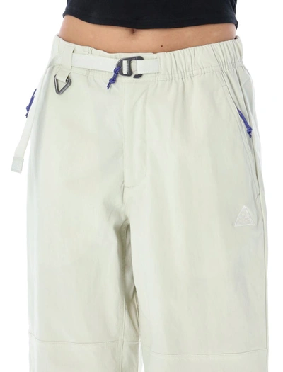 Shop Nike Acg "uv Hike" Mid-rise Pants In Seaglass White