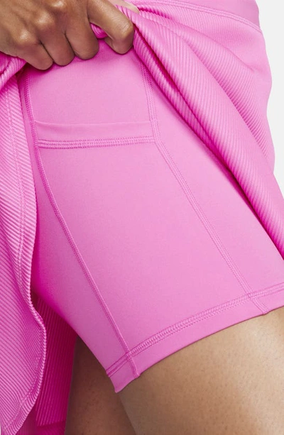 Shop Nike Dri-fit Ribbed Miniskirt In Playful Pink/ White