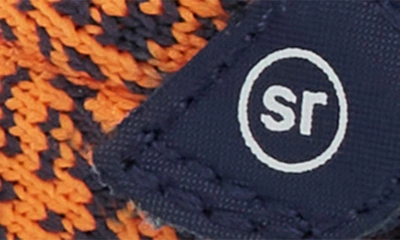 Shop Stride Rite Soft Motion Zips Runner Sneaker In Navy/ Orange