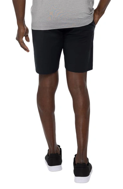 Shop Travis Mathew Open To Close Tech Chino Shorts In Black
