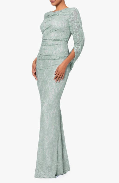 Shop Betsy & Adam Drape Back Cape Sleeve Lace Trumpet Gown In Sage