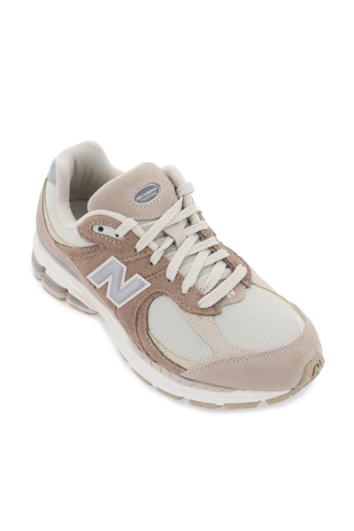 Shop New Balance 2002r Sneakers In Beige,brown