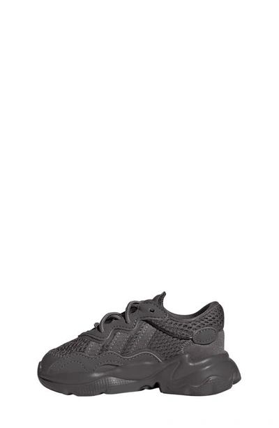 Shop Adidas Originals Kids' Ozweego Sneaker In Charcoal/ Charcoal/ Charcoal