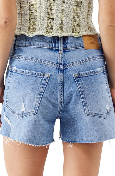 Shop Bdg Urban Outfitters Low Rise Raw Hem A-line Denim Shorts In Mid Vintage
