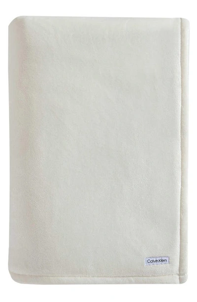 Shop Calvin Klein Core Plush Blanket In Beige/ Tan